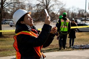 Mary Valdez is Denver’s public art program coordinator. Here, she oversees the completion of Jaime Molina’s “La Veleta/The Weathervane.”  (Photo by Kevin J. Beaty/Denverite)